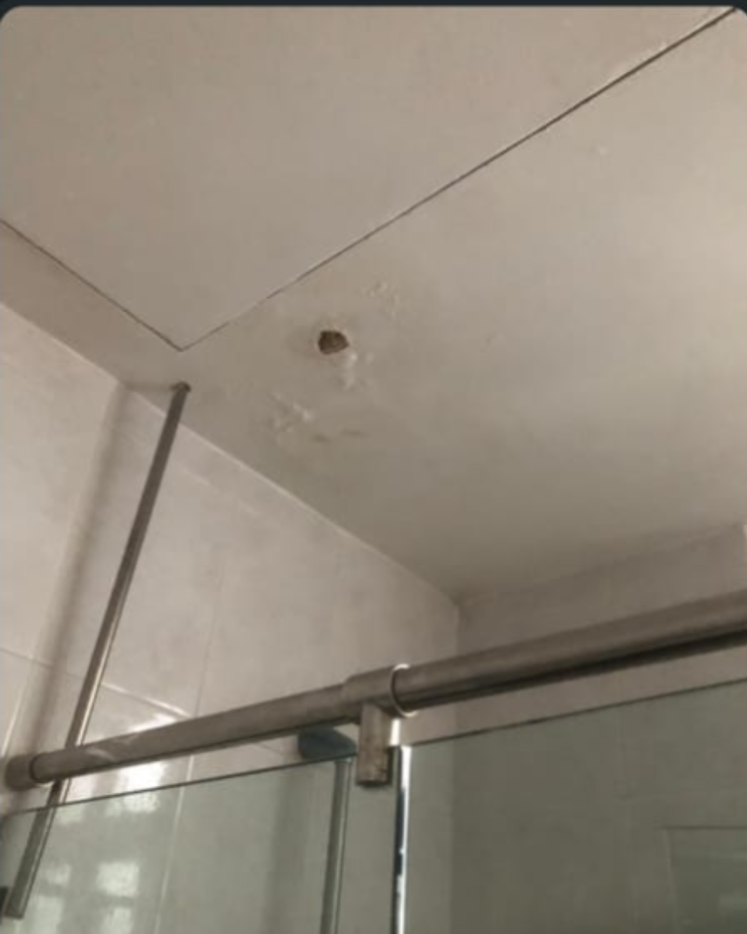 Before photo of piping leakage under sink in Singapore
